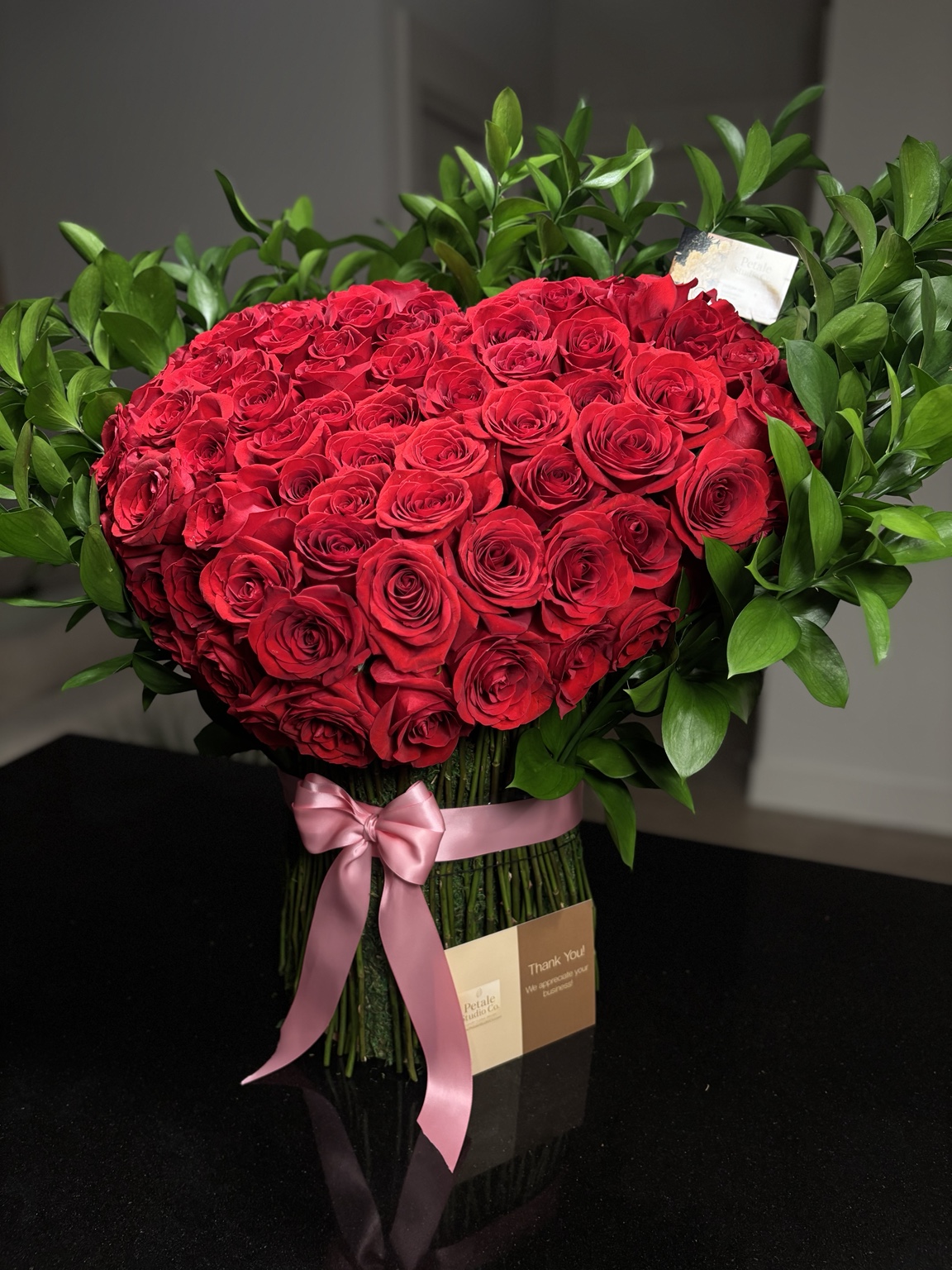 Petale Studio Co. Signature Heart Stand made of red roses and greenery