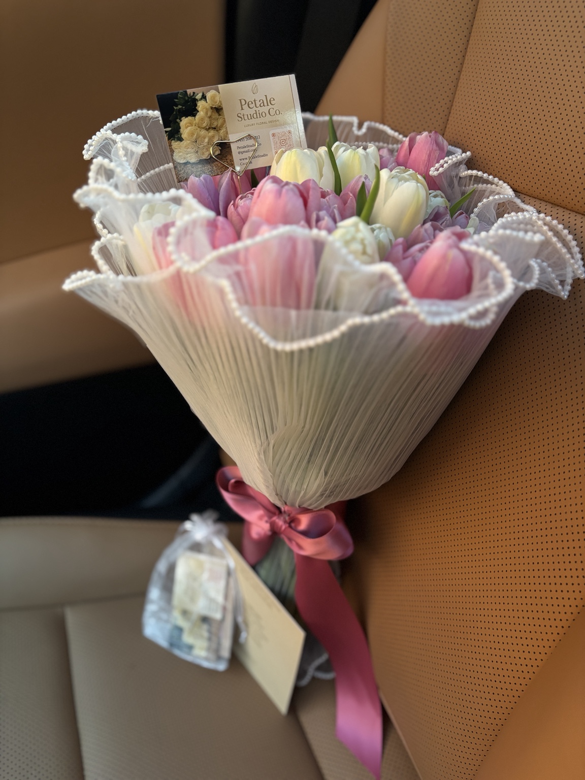 Pink and white tulip bouquet with pearl-trimmed wrap