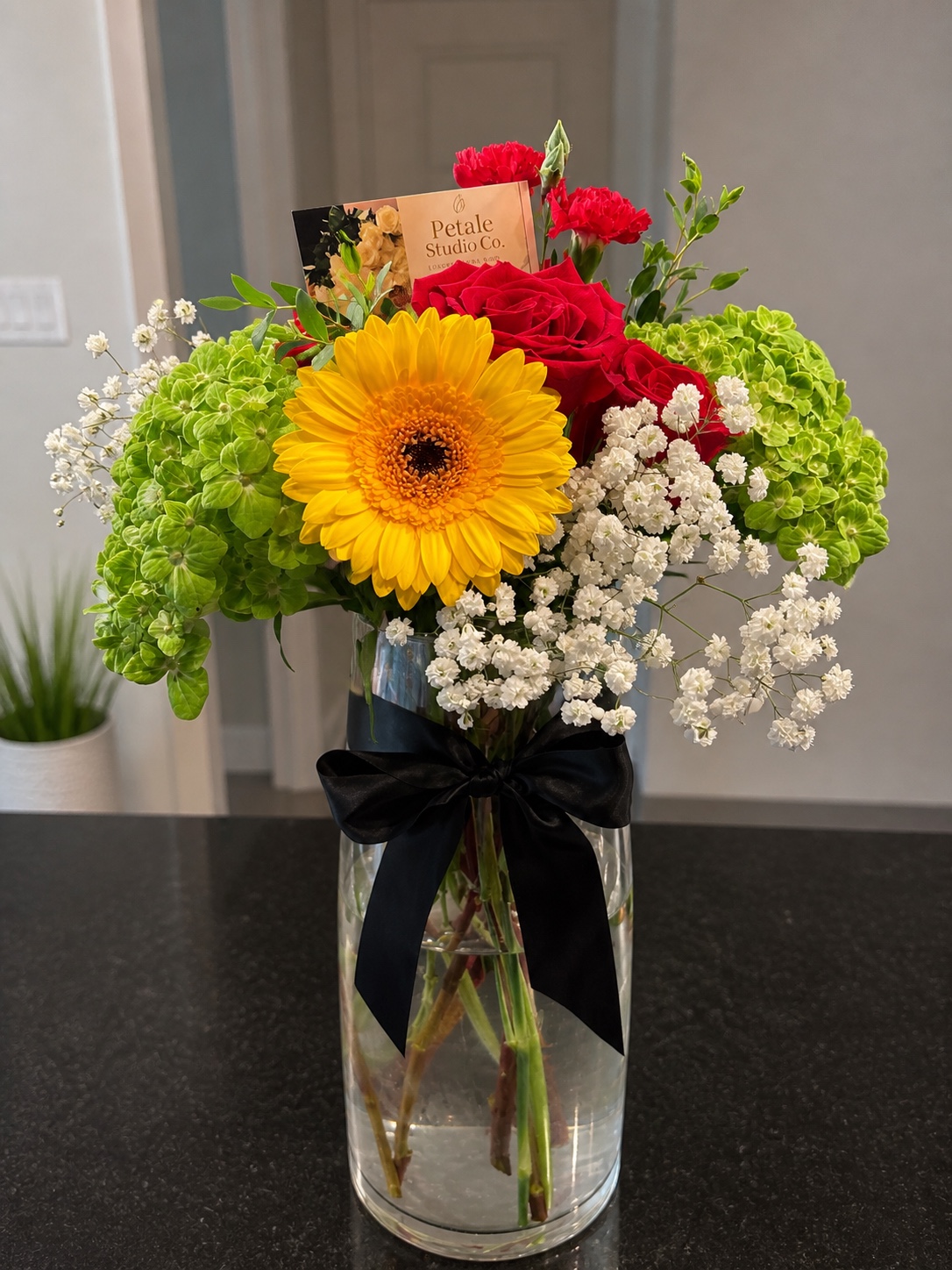 Colorful seasonal flower arrangement in a clear vase